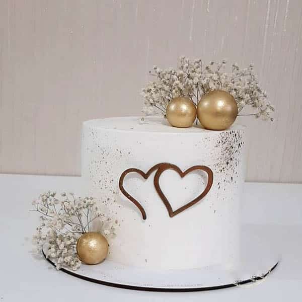 white theme anniversary cake